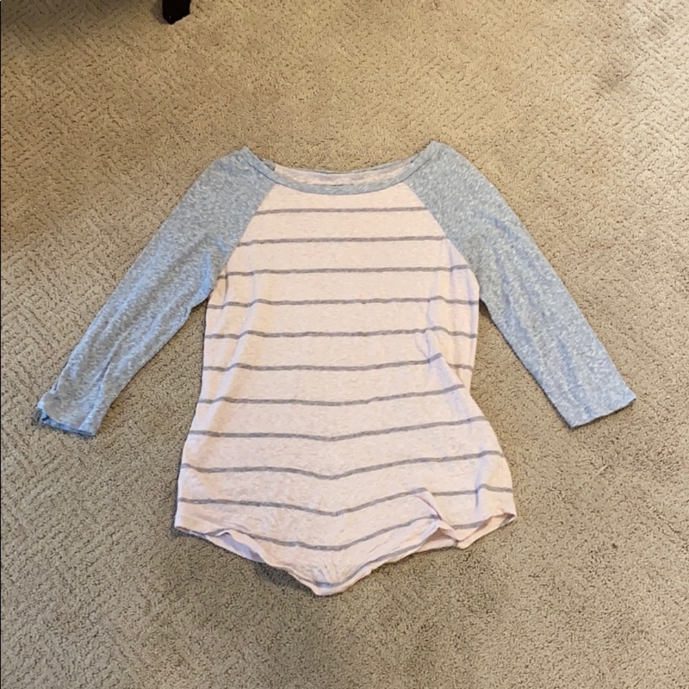 I’m selling a pink and gray striped shirt.